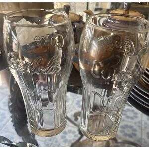 Coca-Cola Set of 2 Clear Glasses Embossed Logo Soda Theme 12 to 15 ounces.